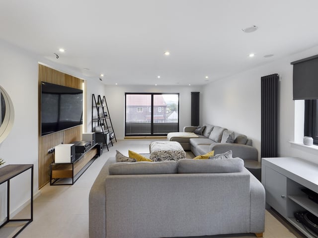 Comfortable seating space within this TV lounge area.