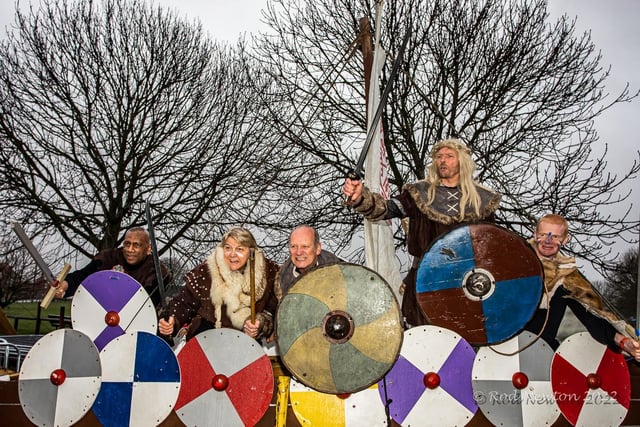 The Vikings got into formation with their shields to defend their longboat.