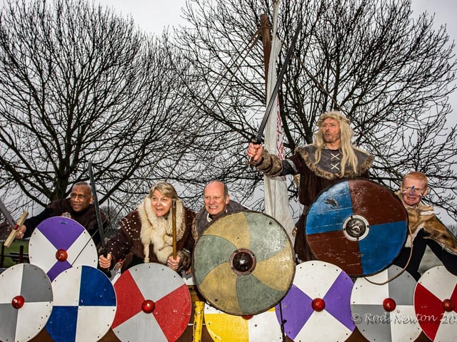 The Vikings got into formation with their shields to defend their longboat.