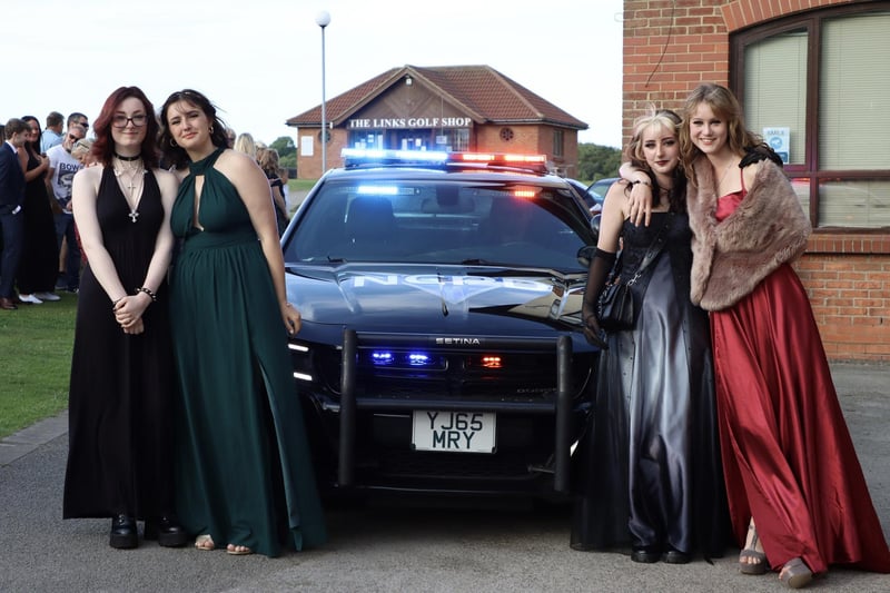 These girls are looking stunning alongside their special car for prom.