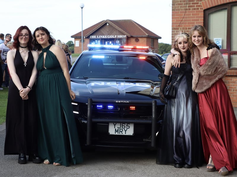These girls are looking stunning alongside their special car for prom.