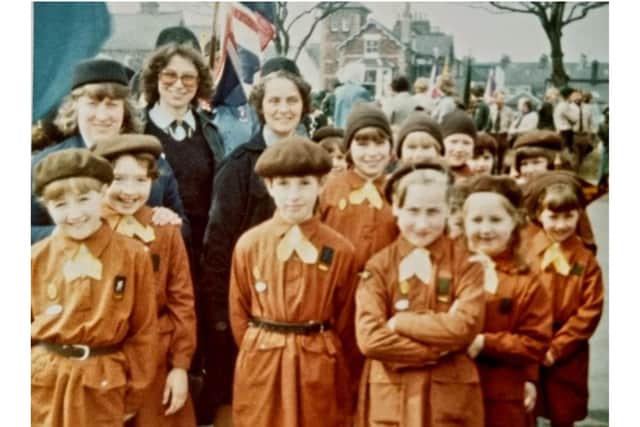 Brownie Leader for St Mary’s Parish Brownies, Scarborough.  This was taken at a St George’s Day Parade in Scarborough circa 1979/80.
Anne, far right at the back, with Anita Kilburn and Kath Alker. Anne’s daughter, Fiona) is in the front with her arms crossed.