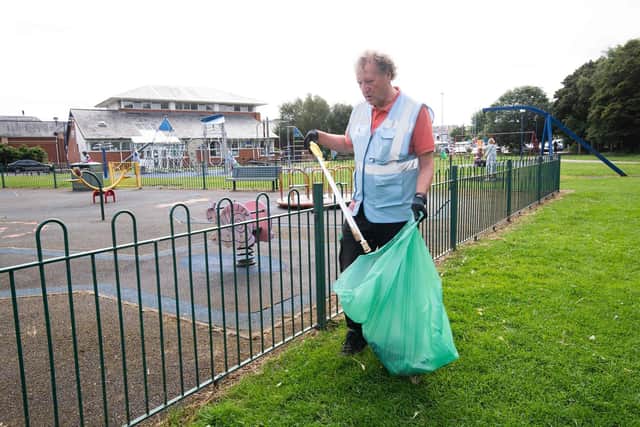 Keep Scarborough Tidy chair, Mick Couzens, carrying out his litter-picking duties near to the Cinder Track.