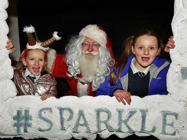 Santa poses for a picture