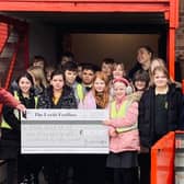 Deputy Chief Lord Dr Allan Watson from the Lord Feoffees handing over a cheque for £1860 to Run With It teacher Mel Johnson and children from Burlington Junior School.