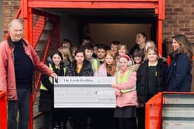 Deputy Chief Lord Dr Allan Watson from the Lord Feoffees handing over a cheque for £1860 to Run With It teacher Mel Johnson and children from Burlington Junior School.