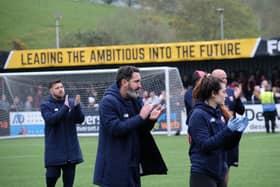 Boro boss Jono Greening and his coaching staff applaud the fans after the final whistle. PHOTO BY RICHARD PONTER