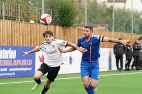 Whitby Town skipper Dan Rowe battles for the ball during the 2-0 loss at Marine on Saturday in the NPL Premier Division PHOTO BY KARL DUNKERLEY