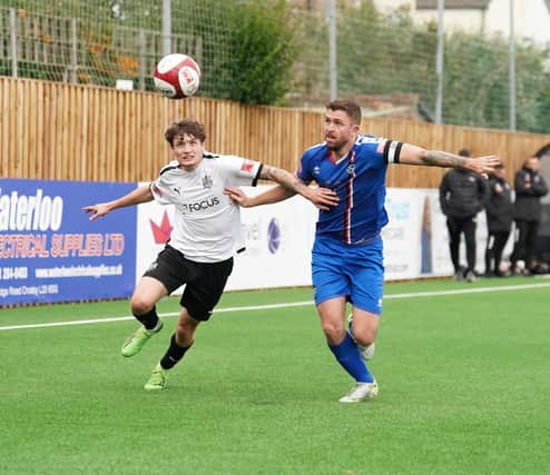 Whitby Town skipper Dan Rowe battles for the ball during the 2-0 loss at Marine on Saturday in the NPL Premier Division PHOTO BY KARL DUNKERLEY