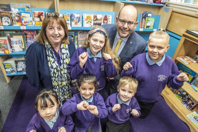 Headteacher Tim Jolly and acting deputy headteacher Michaela Chalk with children at Braeburn Primary and Nursery Academy, celebrating positive comments from school inspectors Ofsted.