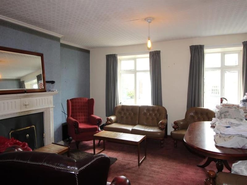 Comfortable seating and a large feature fireplace inside The Brown Cow.