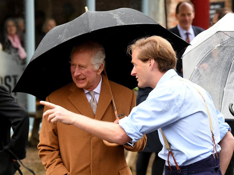 King Charles is delighted by something off camera.