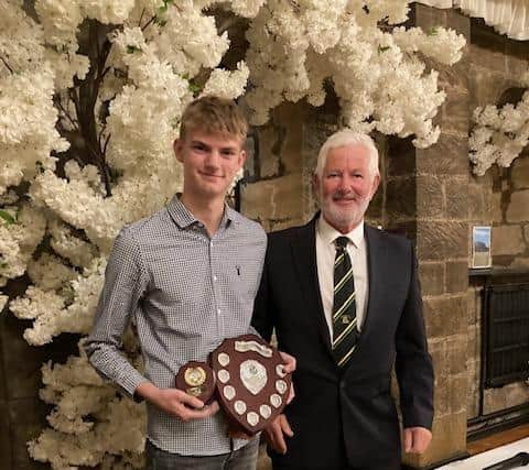 Rhys Buck shows off the Whitby CC 3rds Batting award for 2022. He also won the prestigious Corporal Damian Lawrence Memorial Trophy for the most improved Under 18 player as he scored over 1,000 runs in his first season playing senior cricket in the NYSD.