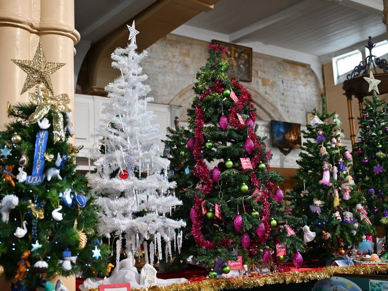 Beautiful Christmas trees adorn the interior of the historic church. photo: Richard Ponter