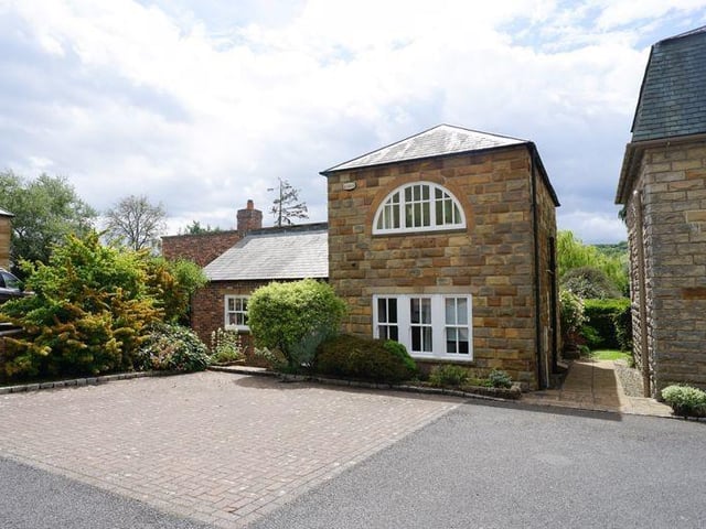 An individually styled three bedroom home within landscaped gardens.