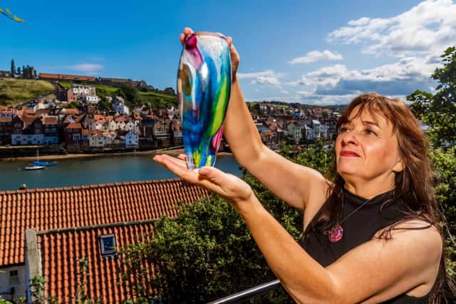 Whitby glassblower Jo Kenny with an example of her work.