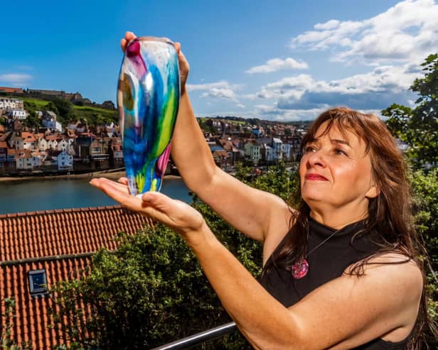 Whitby glassblower Jo Kenny with an example of her work.