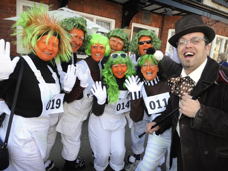 Willy Wonka (Colin Nolan, right) with his Oompa Lumpas