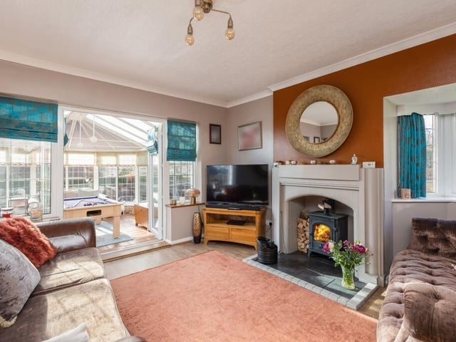 A cosy woodburner in the lounge that leads through to the conservatory.