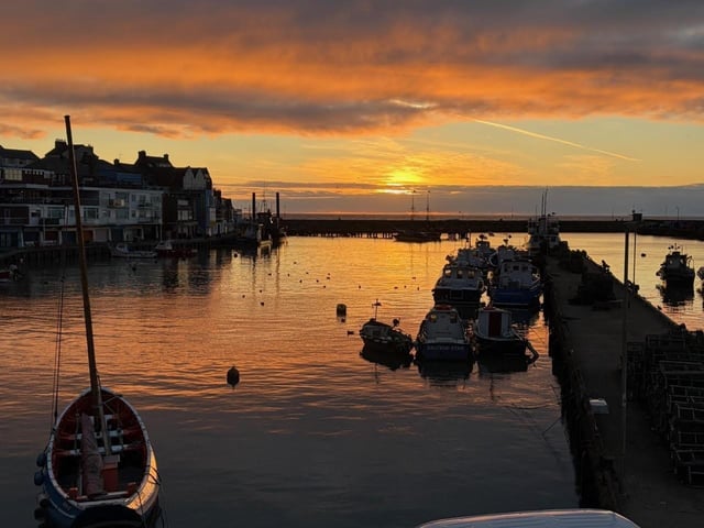 Ian Sandy's great shot features orange hues above the harbour.