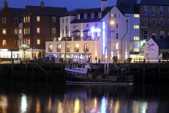 The New Angel Hotel at night.