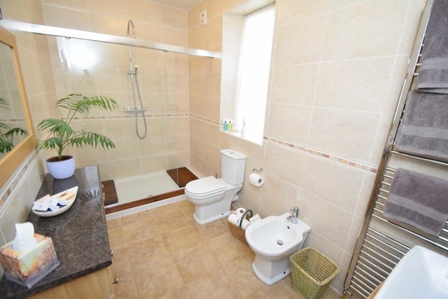An en suite shower room is linked to one of the bedrooms.