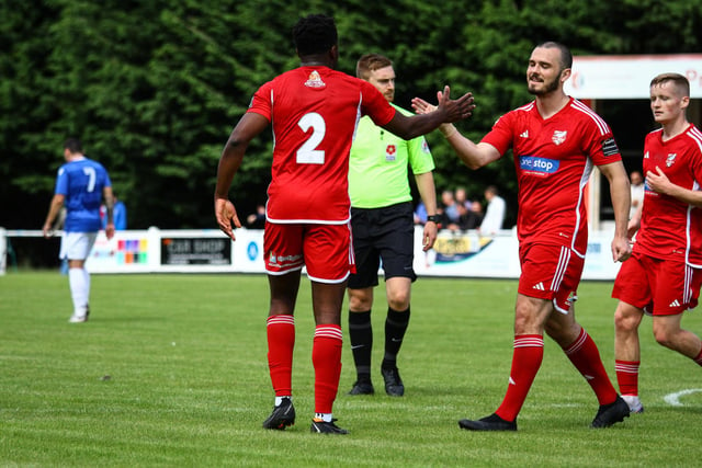 Two-goal hero Kieran Weledji is congratulated by teammate Frank Mulhern after one of his goals in the win against Marske.