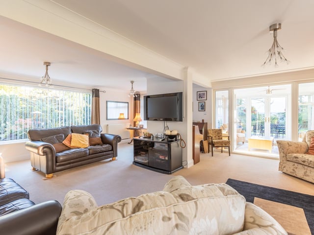 A lovely, light reception room with picture window.
