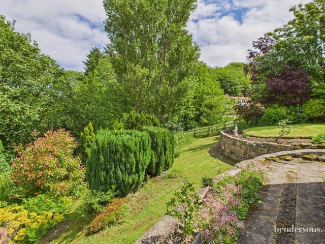 A lush, lawned and landscaped garden adds to the appeal of the property.