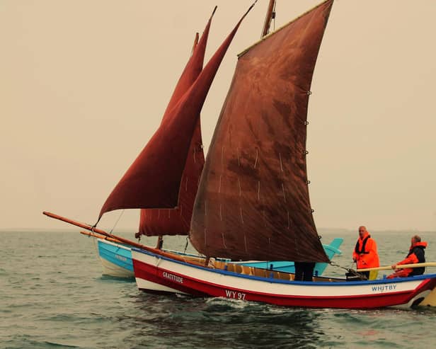 The sailing cobles Kathleen and Gratitude sail side-by-side.