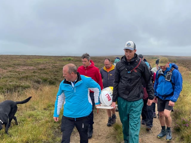 The team picked up a four-legged walking companion along the way