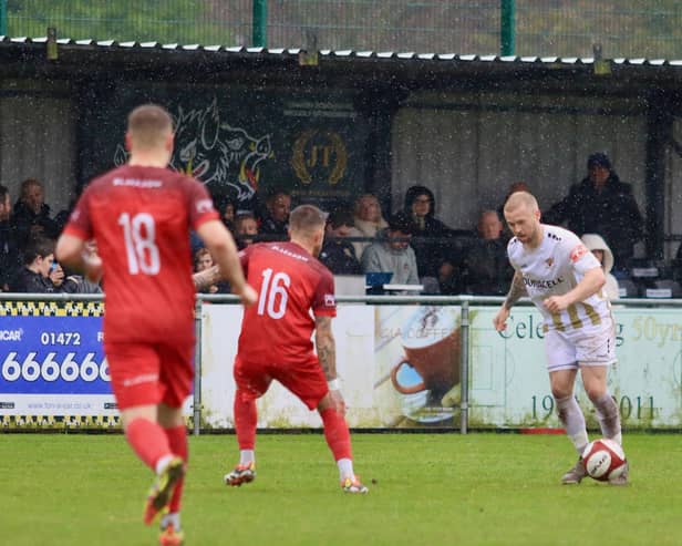 Danny Earl was on target as Bridlington Town earned a crucial 2-0 win at Grimsby Borough to seal their NPL East Division survival.