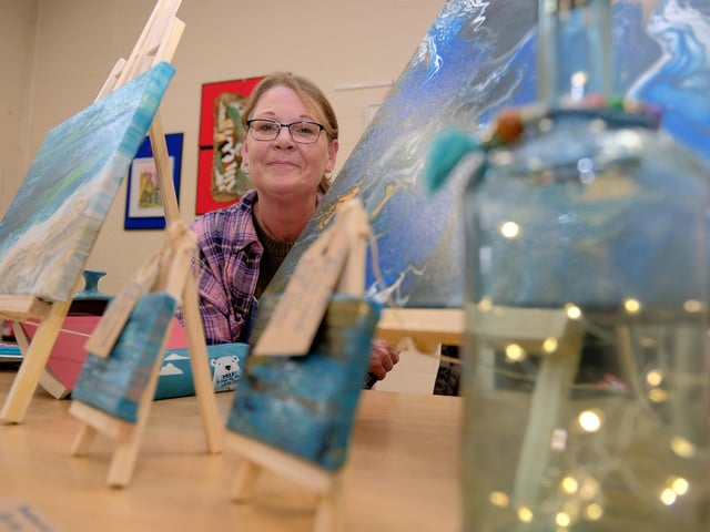 Artist Sarah Wakelin with her work