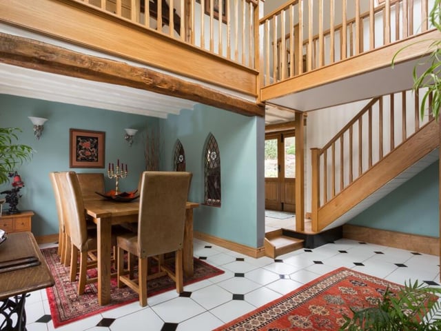A section of the spacious interior, with the gallery landing above.