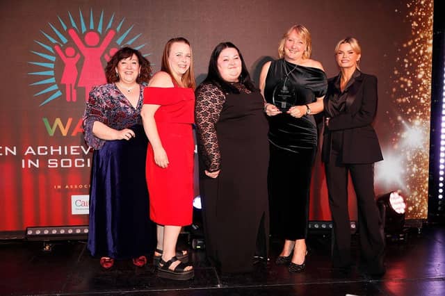 Clare Tomlinson (in red) to her right Leonne Ridsdale and Samantha Hunt receive their award