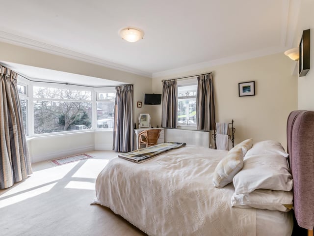 A dual aspect, double bedroom with large bay window.