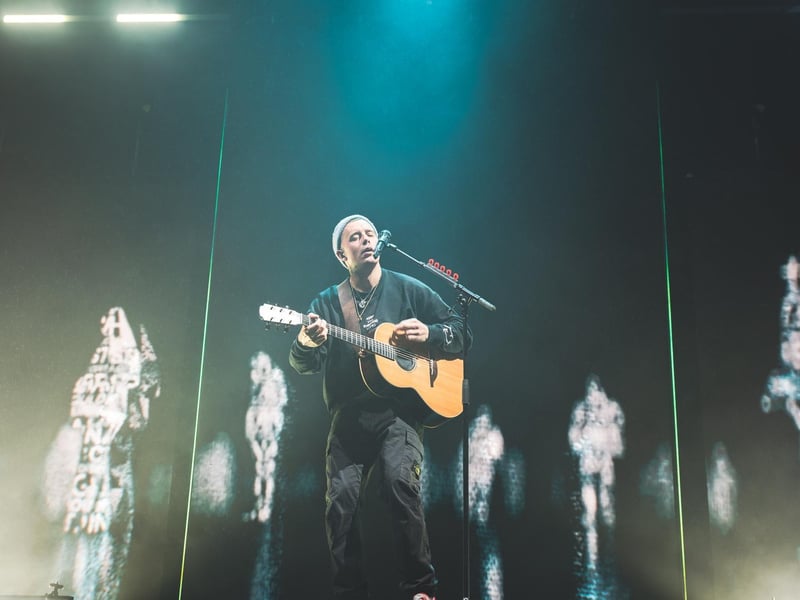 Dermot Kennedy on stage performing a selection of his hits.