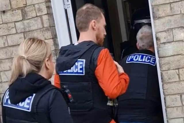 Officers enter the property on Prospect Road