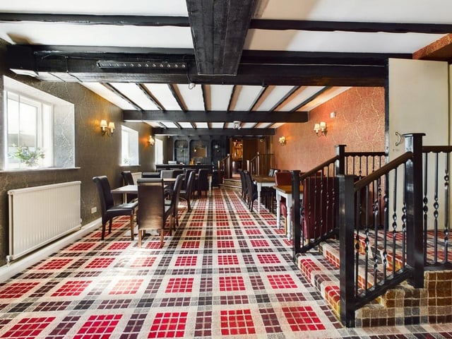 The property has two large bar areas, a restaurant, a function room, and a commercial kitchen.