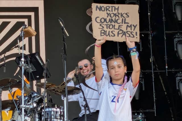 Ciel, aged 11, held up a placard containing the message ‘North Yorks Council Stole My Bus Pass!’ in front of the crowd watching performances on the West Holts stage at Glastonbury Festival