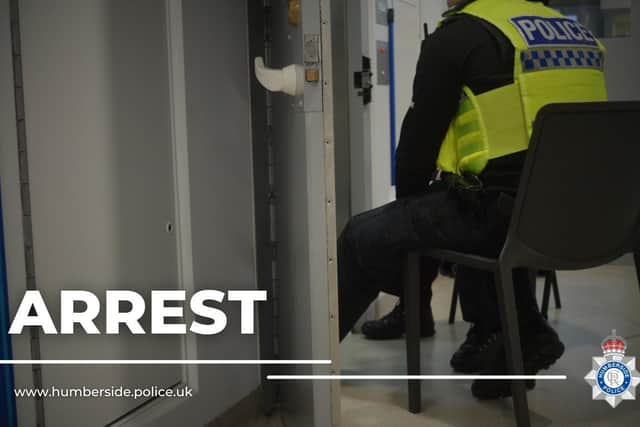 Two men have been arrested after police officers were called to reports of a van being broken into on Travis Street.