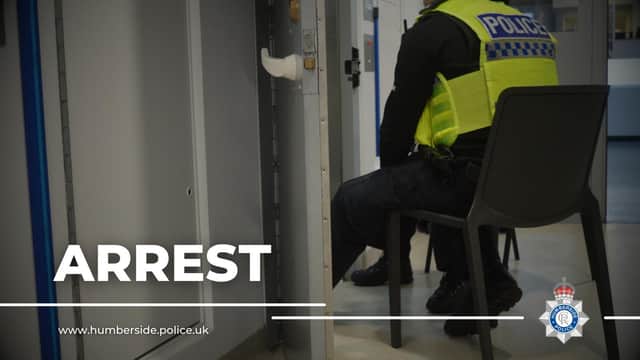 Two men have been arrested after police officers were called to reports of a van being broken into on Travis Street.