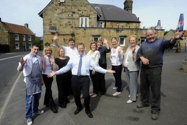 Cloughton Business Owners Share Fond Memories Of Her Majesty The Queen’s Visits 2 Offering a right Royal welcome to Her Majesty, the staff of the Blacksmiths Arms in Cloughton, where the Queen will be eating her first ever pub lunch, and village blacksmith Alan Readman(R). From left, Daniel McLean (chef), Jill Armitage(chef), Danielle Hinchliffe (waitress), David Arnall(head chef and joint owner), Tony Arnall(landlord), Josie Toase (housekeeper), Lorna Arnall (head waitress), Gemma Arnall, Jean Arnall (joint owner) and Mr Readman.