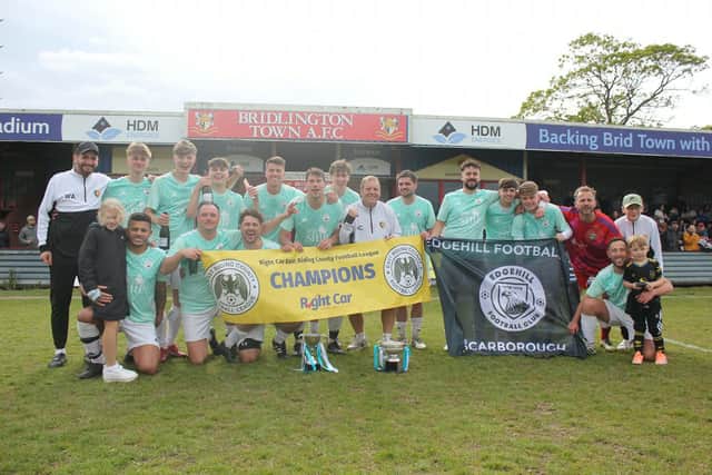 Edgehill FC players celebrate their 4-2 HE Dean Cup final win against AFC North at Queensgate.