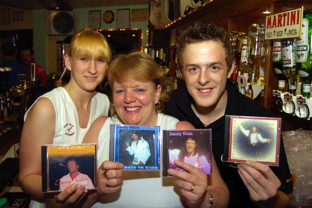 Danny Wilde and his fans with CDs at the Aberdeen Hotel in 2004.