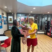 Jennifer Dale receives flowers from the Ryedale Swim and Fitness Centre team