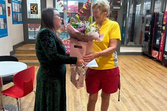Jennifer Dale receives flowers from the Ryedale Swim and Fitness Centre team
