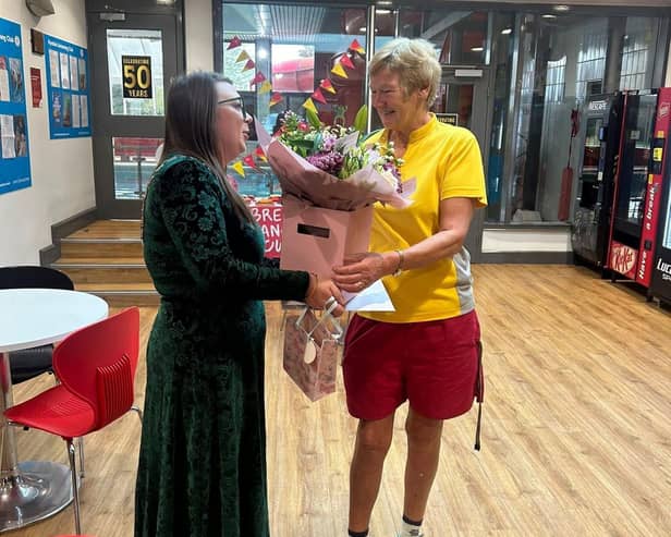 Jennifer Dale receives flowers from the Ryedale Swim and Fitness Centre team
