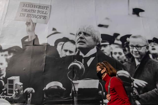 A satirical poster from the group Led By Donkeys depicting Boris Johnson as former British prime minister Neville Chamberlain delivering his “Peace for Our Time” speech in Kentish Town, London (Photo: Justin Setterfield/Getty Images)