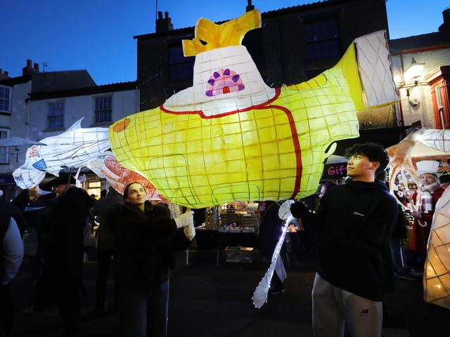 The lanterns light up the evening sky.